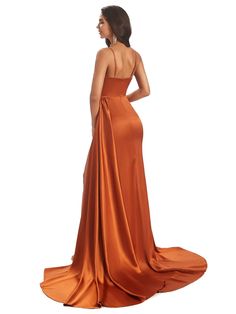 a woman in an orange dress is looking back