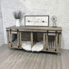 the dog crate is made out of wood and has two doors on each side, one with