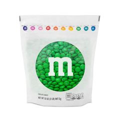 m & m's green candy beans in a white bag on a white background