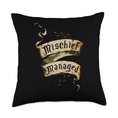 a black pillow with an old scroll and the words mischef managed on it