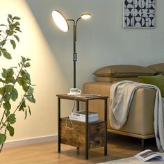 a living room scene with focus on the floor lamp and table next to the couch