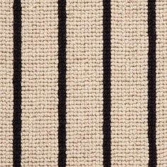 black and white striped rug with vertical stripes on the bottom, in an up close shot