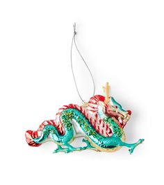 a christmas ornament with a green and red dragon on it