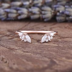 a close up of two rings on top of a wooden table