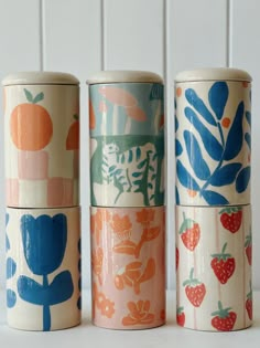 three different types of ceramic containers on a table