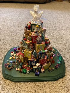 a small christmas tree made out of boxes