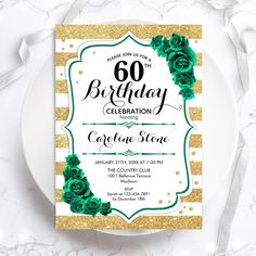 a white plate topped with a green and gold 60th birthday party card on top of a table