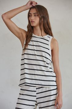 black striped ribbed knit top - soft and stretchy loungewear Striped Crew Neck Tops For Vacation, Summer Striped Tops For Loungewear, Striped Tops For Summer Loungewear, Casual Sleeveless Top With Contrast Stripes, Striped Nautical Tops For Summer, Nautical Striped Tops For Summer, Vertical Stripes Tops For Summer Loungewear, Casual Sleeveless Vertical Stripes Tank Top, Casual Sleeveless Tank Top With Vertical Stripes