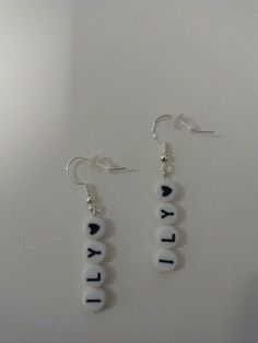 Cute earrings that can be personalized! You may choose any word, letters or initials up to 4 letters. You can also use either black or red hearts (this counts as one letter) in your 4 letters. Word Earrings, Letter Earrings, Chevy Chase, Letter L, Personalized Letters, Aesthetic Wall, Red Hearts, Cute Earrings, Red Heart