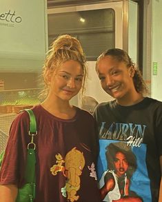 two young women standing next to each other