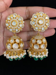 These earrings would have a luxurious, traditional jhumki design, combining modern moissanite brilliance with Kundan beauty. Goddess Dress, Kundan Earrings, Cz Earrings, Finger Rings, Antique Earrings, American Diamond, Pendant Set, Designer Earrings, Bridal Jewelry