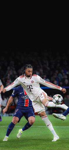 two men are playing soccer on the field