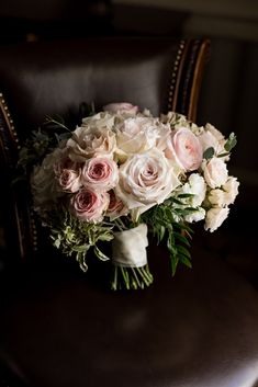 a bouquet of flowers sitting on top of a chair