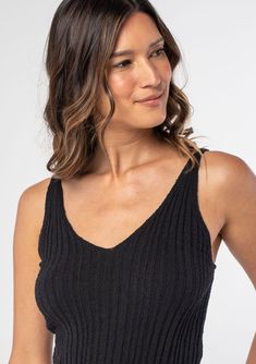 We love this ribbed knit tank top for its slim fit and ultra-flattering neckline. A touch of stretch helps to maintain its shape. A super versatile style that pairs well with jeans or a bohemian skirt. Ribbed knit Slim fit Sleeveless V-neckline Adjustable straps Basic knit tank top Model is 5'9, wearing a size S.Style: I-51011K-RWO Seamless V-neck Tank Top For Day Out, Beach V-neck Stretch Knit Top, Trendy Ribbed Stretch Camisole, Trendy Stretch Ribbed Camisole, Chic Stretch Tank Top For Vacation, Chic Stretch Knit Top For Loungewear, Fitted Ribbed Tank Top For Loungewear, Trendy Ribbed Tank Top For Beach, Trendy Ribbed Tank Top For The Beach