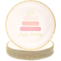 a white plate with a pink and yellow cake on the front, sitting on top of twine