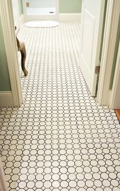 an image of a tiled floor in the hallway