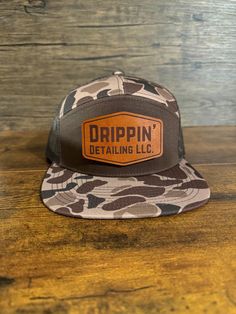 These custom order Bark Brown Duck Camo 7 panel hats from Richardson are available in limited quantities. Get them while you can. Not part of the regular Richardson 168 colorways, and must be custom ordered from Richardson.  Available blank or with one of our real leather patches with your personalized or business logo on them.  Leather Patch Options: * Bourbon - Dark brown leather patch  * Oak - Light brown leather patch  * Black - Black Leather Patch - Real leather, engraves black on black, with low contrast. Looks great outdoors or in good lighting.  Send us a message for bulk or custom orders if you don't see the hat you're looking for! Leather Patch Hat, Patch Hats, Patch Hat, Light Brown Leather, Panel Hat, Dark Brown Leather, Custom Leather, Leather Patches, Cool Lighting