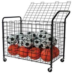 several soccer balls in a wire basket on wheels