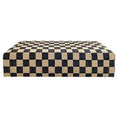 a black and white checkered bench on a white background