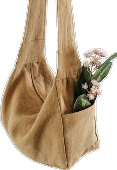 a bag with flowers in it is hanging from the side and has two straps on each side