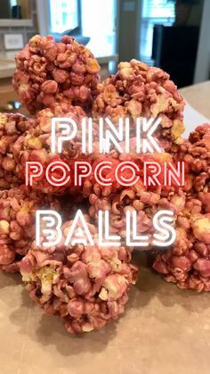 pink popcorn balls are stacked on top of each other with the words pink popcorn balls above them