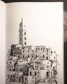 an open book with a drawing of a town on it's cover and a clock tower in the background