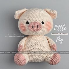 a small crocheted pig sitting on top of a gray background with the words little ambient bear written below it