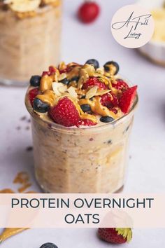 an oatmeal in a glass with berries and nuts on top