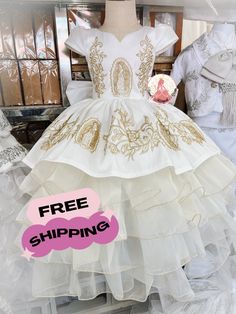 Vestido de niña charra  Mexican charra dress  Available in ivory with gold or white and silver Includes: *sombrero *Dress * Detachable Bow *FREE ground service shipping Hand made in Mexico No returns No refunds  Happy to help with sizing Purchase from our website for a discount ❤️ WWW.Emmasmagicaldream.com Charro Dress, Quince Planning, Vestido Charro, Baptism Girl, Wedding Color, Toddler Girl Dresses, Wedding Colors, Toddler Girl, Violet