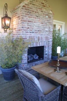 a dining room table with chairs and a fire place