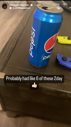 a can of pepsi sitting on top of a table