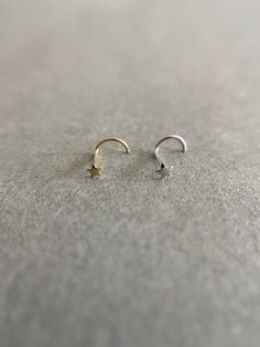 14K Solid Gold Star Screw Nose Studs -14K Solid Gold ★ Quantity: One Nose Stud ★ Gauge : 22 Gauge ★ Size : 2.5mm / 12mm long ★ End : Screw ★ Color : Yellow Gold / White Gold ★ Materials : 14K Solid Gold ★ Comes in a jewelry box. If you need extra boxes for gifting....just let us know! Small Nose Studs, Nose Studs, Nose Jewelry, Nose Ring Stud, Nose Rings, Nose Stud, Gold Price, Genuine Turquoise, Gold Star