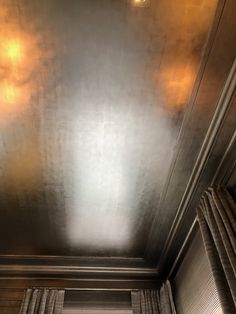 an image of a metallic ceiling that looks like it is going to be painted gold