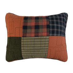 an orange and black patchwork pillow on a white background