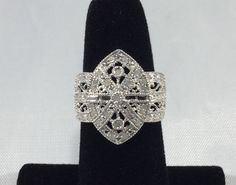 The past will always return in the fashion world and this piece is back for round two! In the 1920's ladies of class wore the most opulent dresses with jewelry to match. As the years continued, jewelry makers tailored pieces to fashion and trends which resulted in affordability for style. Presenting this Beautiful Vintage Sterling Silver Ladies 3/4 Carat Diamond Cocktail Ring Featuring Elegant Victorian Filigree Style Design. This show-stopping ring features a whopping 43 Individual authentic di Elegant Formal Rings With Historical Design, Elegant Rings With Historical Design For Formal Occasions, Elegant Historical Design Rings For Formal Occasions, Victorian Style Diamond Ring For Formal Occasions, Victorian Filigree, Anniversary Rings For Her, Vintage Jewlery, Diamond Cocktail Ring, Round Two