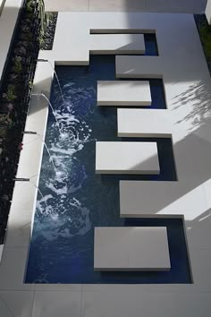 a water feature in the middle of a garden