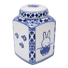 a blue and white jar with a rabbit on it