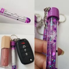 a person holding a cell phone and two different keychains, one with glitter on it