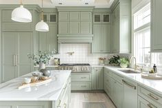 a kitchen with green cabinets and white counter tops