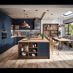 a large kitchen with blue cabinets and wooden floors is pictured in this image, there are several chairs around the island