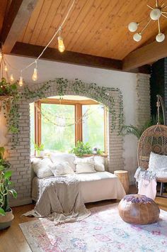 a living room filled with furniture and plants