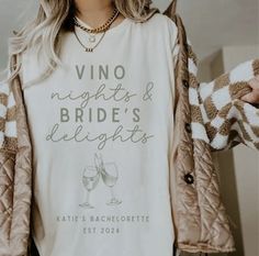 a woman wearing a t - shirt that says vino nights and bride's delights