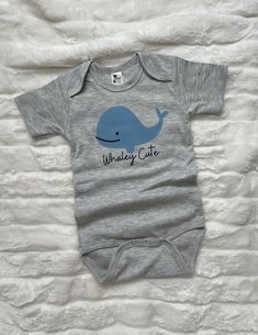 This week 'Whaley Cute' bodysuit for your little one is so soft and comfy. Great for everyday wear or a beach vacation! Image is a DTF transfer and will last through all the washes! Comfy enough to play in all day for your little one! All shirts are made to order and my current turn around time is about 2 weeks until your order will ship. Please keep this in mind when ordering. Cute Blue Short Sleeve Bodysuit For Summer, Short Sleeve Cotton Onesie For The Beach, Cute Blue Onesie For All, Fitted Short Sleeve Playful Onesie, Cute Blue Unisex Onesie, Fitted Crew Neck Casual Onesie, Fitted Casual Crew Neck Onesie, Fitted Short Sleeve Onesie For Family Matching, Cute Fitted Onesie For The Beach