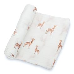 a baby blanket with giraffes on it