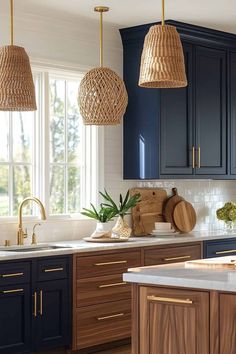 a kitchen with blue cabinets and wooden counter tops, hanging lights over the sink area