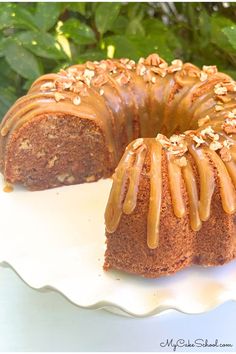 a bundt cake with caramel drizzled on top sitting on a white plate