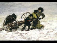 two men pushing a wagon in the snow