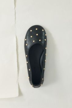 A modern ballet flat in nappa leather, hand-detailed with a fine gold studs.