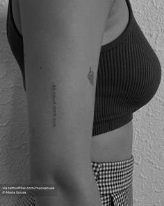 a woman with a small tattoo on her arm