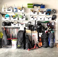 a garage filled with lots of different types of sports equipment and items on shelving units